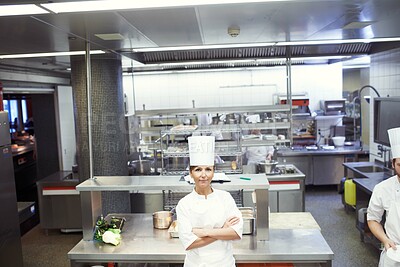 Buy stock photo Chef, woman and confident in industrial kitchen, restaurant and gourmet meal prep and serving. Crossed arms, catering service and culinary skills, nutrition and working in hospitality industry
