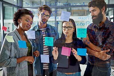 Buy stock photo Group, brainstorming and notes on glass in office for schedule or daily routine for tasks or targets. Employees, window and creative designers looking on calendar for projects, timelines and goals.