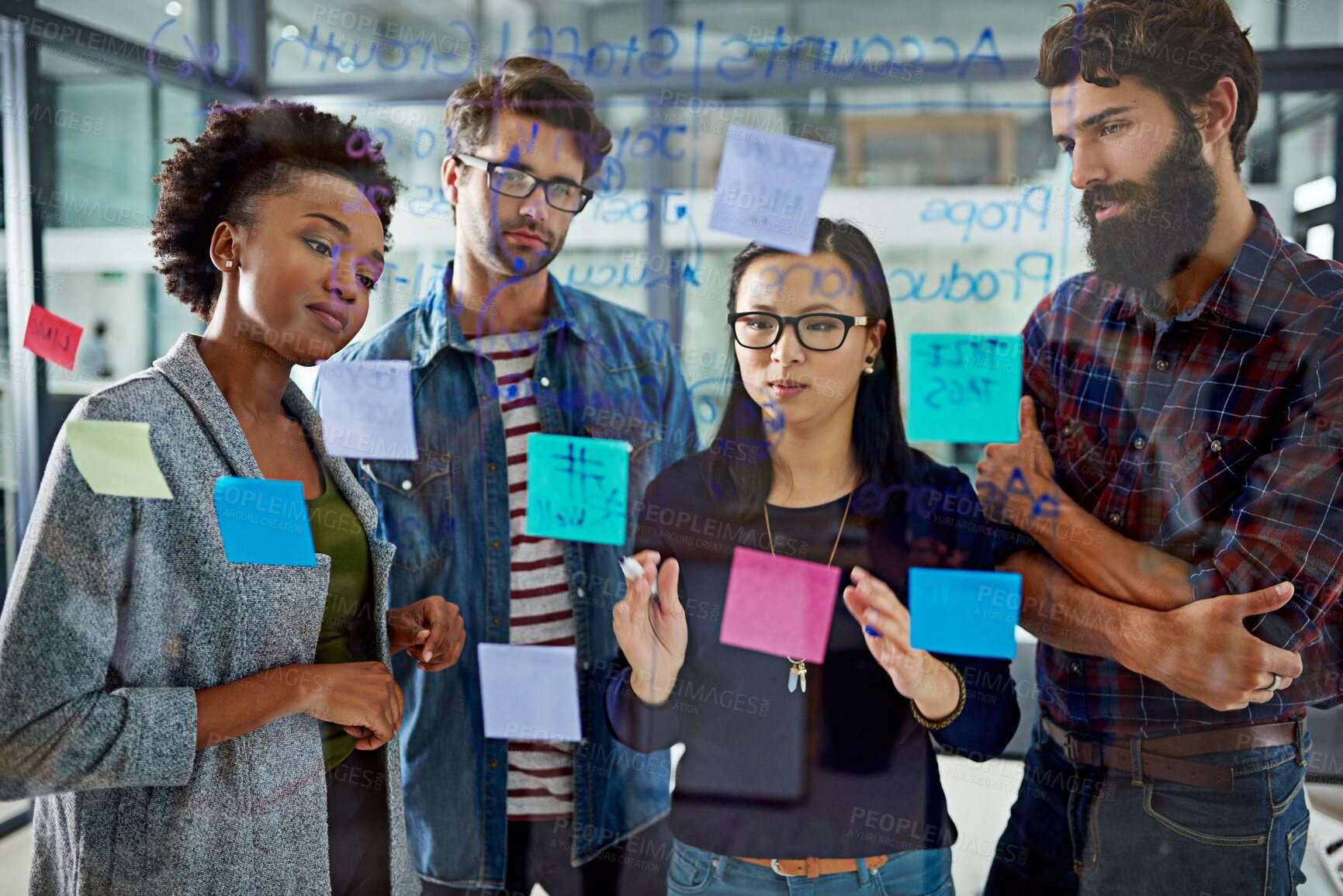 Buy stock photo Group, brainstorming and notes on glass in office for schedule or daily routine for tasks or targets. Employees, window and creative designers looking on calendar for projects, timelines and goals.