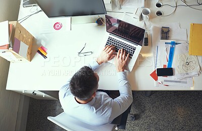 Buy stock photo Above, man and typing at laptop screen for creativity, design process or article writing in office. Editor, computer or connectivity in agency for research, story development or networking at desk