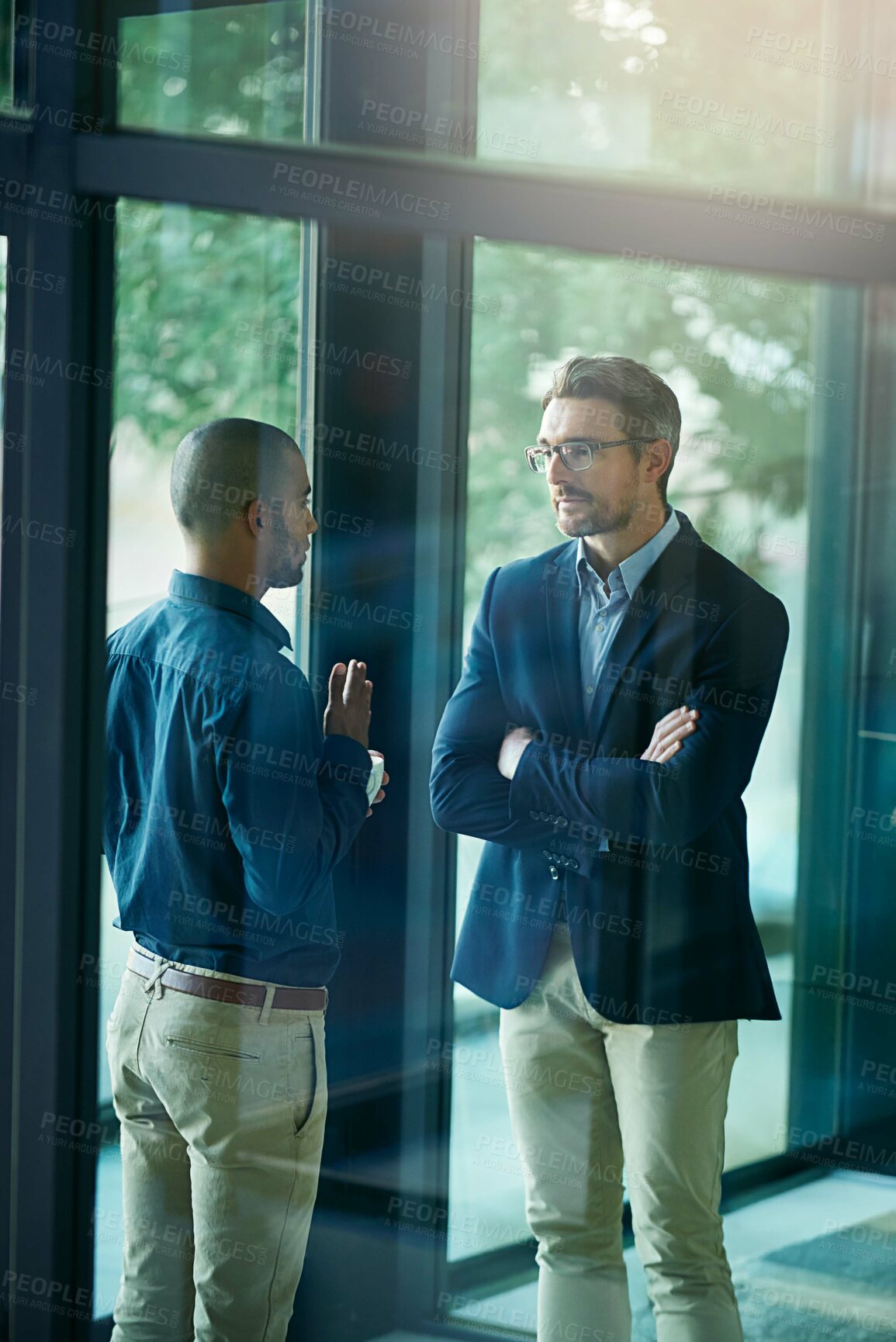 Buy stock photo Business men, serious and team discussion for advice, planning or brainstorming together. Meeting, project collaboration and salesman listening to coworking proposal, feedback or ideas in office