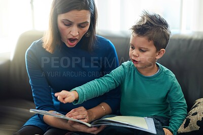 Buy stock photo Sofa, mother and son with book for leaning at home, child development and education for growth. Living room, mom and boy bonding with storytelling, reading and fantasy for entertainment on couch