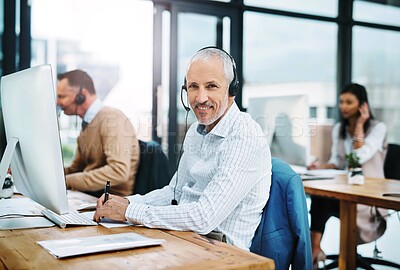 Buy stock photo Mature man, portrait and call centre operator in coworking office, crm and consultant for support. Male person, headset and telemarketer for sale service, writing notes and information for assistance
