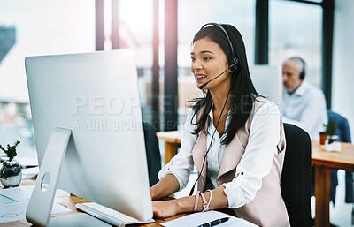 Buy stock photo Cropped shot of an attractive young female operator working at her desk