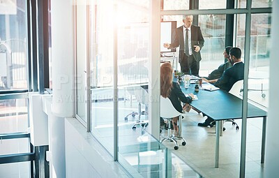 Buy stock photo Corporate, business people and meeting with screen presentation in glass boardroom for discussion on company growth at office. Businessman, CEO or executive talking for team, improvement or expansion