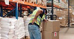 Pallet truck, man and back pain in warehouse with transport, safety and storage for distribution or delivery. Freight operator, logistics and stock in cardboard for shipping, cargo and inventory