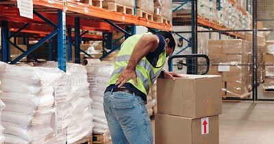Buy stock photo Pallet truck, man and back pain in warehouse with transport, safety and storage for distribution or delivery. Freight operator, logistics and stock in cardboard for shipping, cargo and inventory