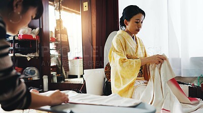 Buy stock photo Fashion designer, workshop and Asian women with fabric for clothes, traditional kimono and indigenous style. Small business, boutique and person with textile and material for tailor service in Japan