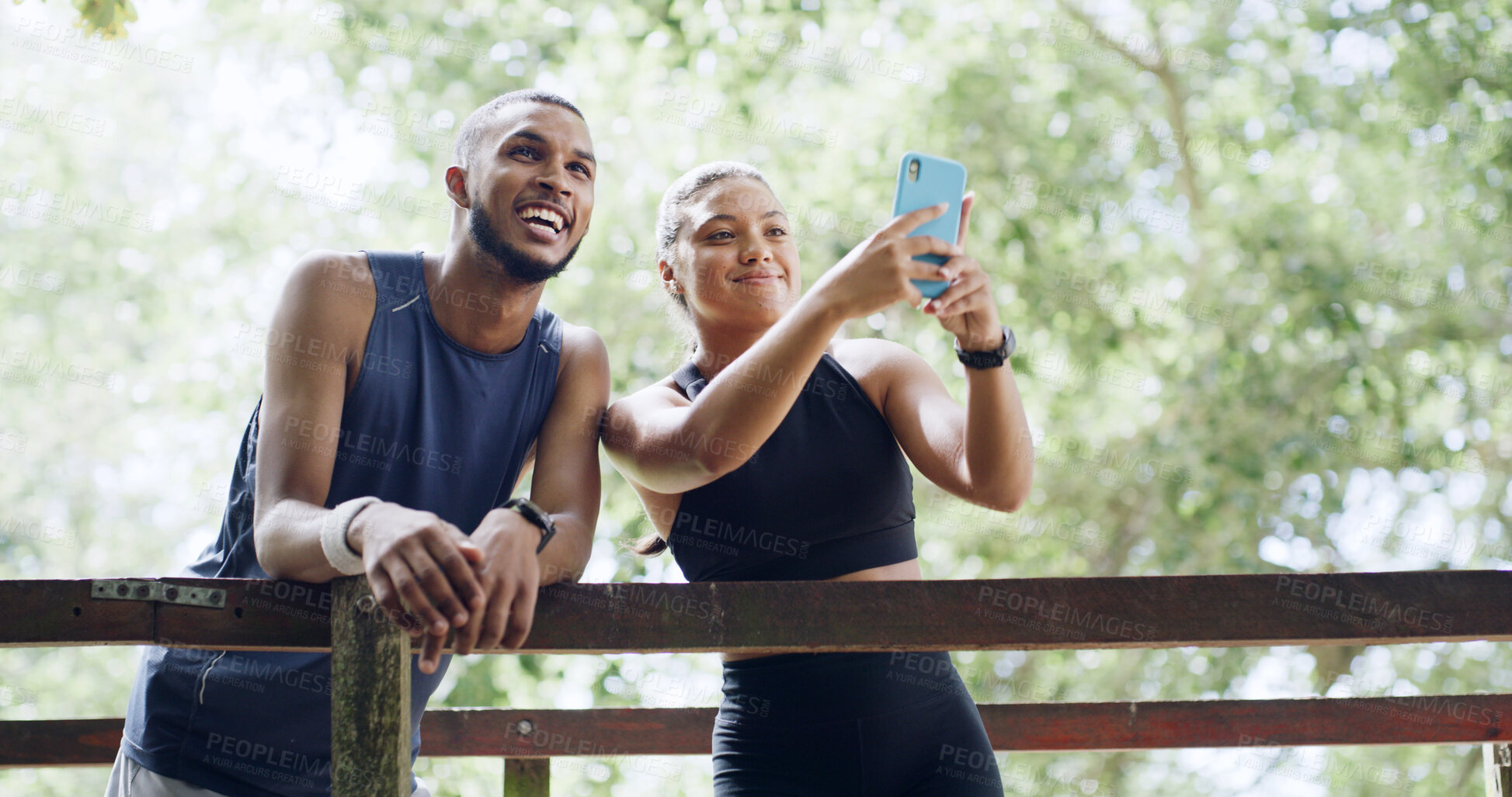 Buy stock photo Photography, happy people or phone on outdoor bridge, social media post or update for profile picture. Fitness, below or friends with mobile app in nature, hiking break and pause together for bonding