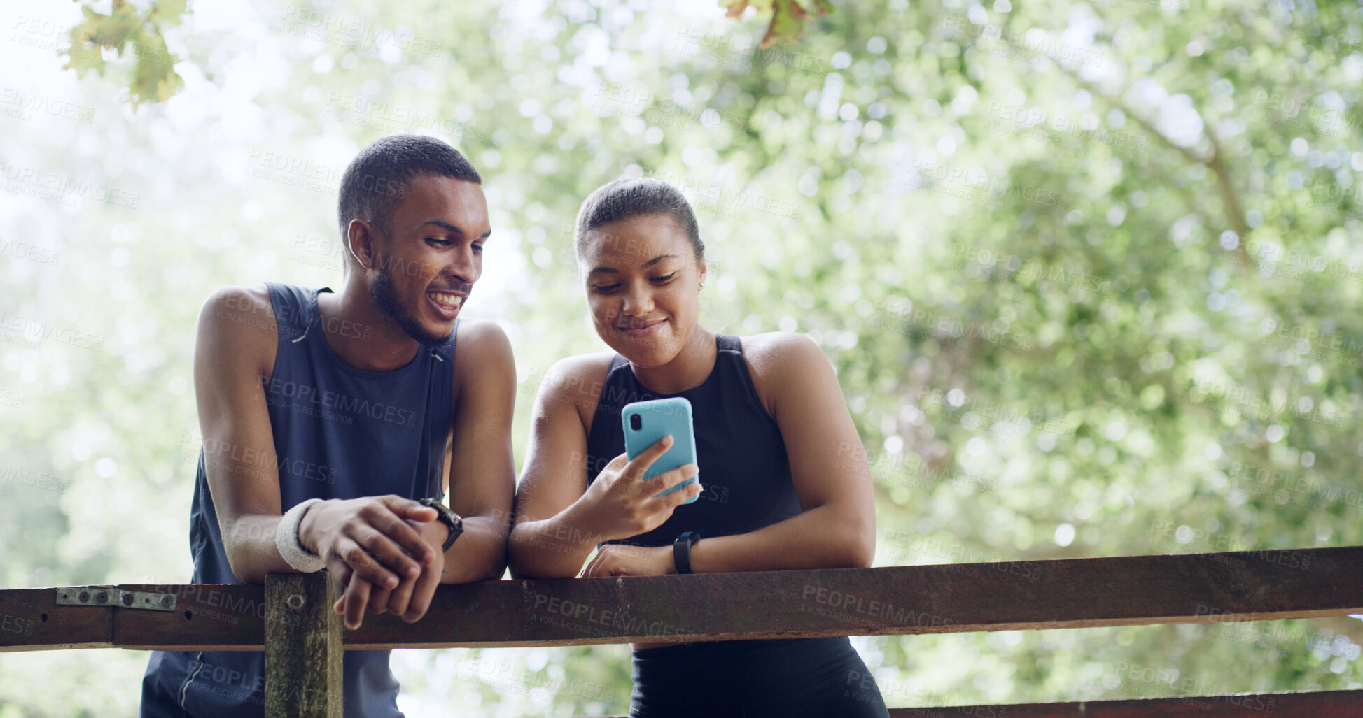 Buy stock photo Hiking, nature and couple with cellphone on bridge, outdoor exercise or digital map for trail navigation. Fitness, step counter and people with mobile location app, fauna or flora research from below