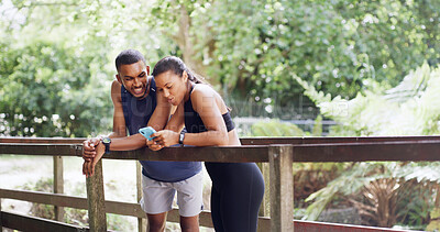 Buy stock photo Hiking, nature or happy couple with phone on bridge, outdoor exercise or digital map for trail navigation. Fitness, step counter and people with mobile location app, fauna and flora research on break