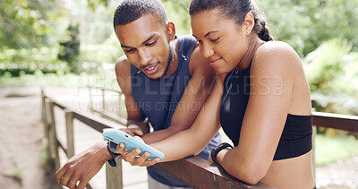 Buy stock photo Internet, outdoor and couple with cellphone, fitness and bonding together with social media. Nature, man and woman with smartphone, website info and digital app to track progress, text and connection