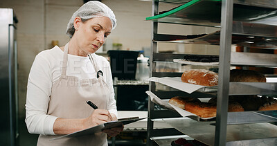 Buy stock photo Restaurant, pastry chef and woman in commercial kitchen with checklist, document and bread. Baker person, paperwork and stock for catering, bakery industry and production for breakfast or snack