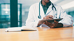 Tablet, notebook and hands of doctor in hospital with medical research for treatment planning. Digital technology, information and African male healthcare worker with online diagnosis in clinic.