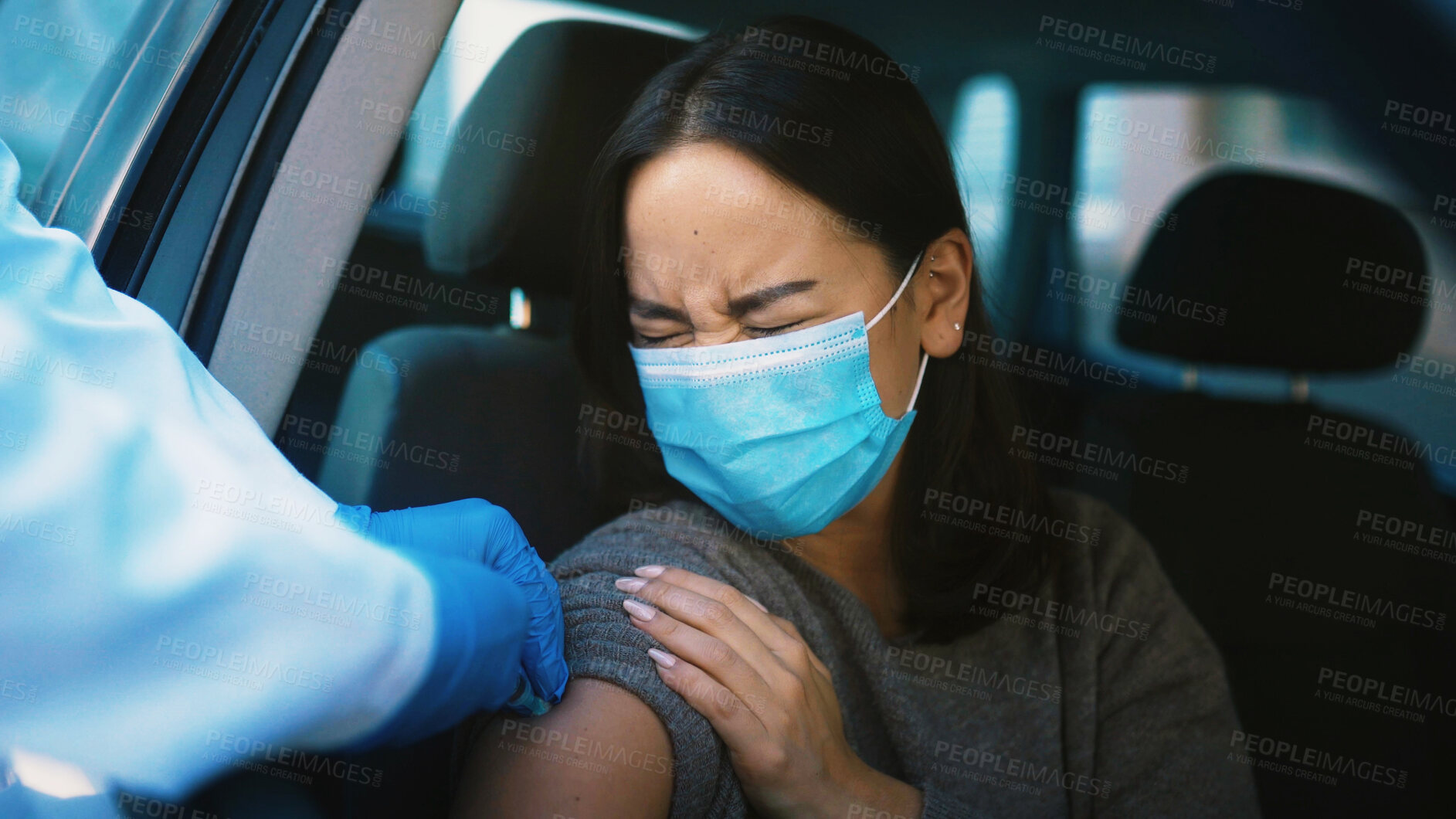 Buy stock photo Patient, sore and hands with vaccine, car and healthcare for Covid 19 prevention, help and treatment. Drive tru, doctor and injection for RSV immunization, pain and booster for woman in vehicle