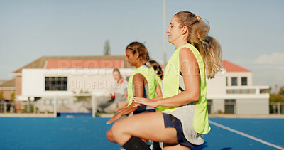 Buy stock photo Hockey, team and women outdoor for training, practice and exercise for competition together. Sports, fitness and people with warm up, knee kicks and ready for match, game and tournament for hobby