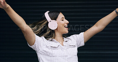 Buy stock photo Happy woman, dancing and listening to music with headphones or vibe on a dark background. Female person, user or excited model with smile for audio streaming, sound entertainment or online podcast
