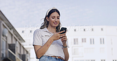 Buy stock photo Low angle, smile and woman in city with phone, post reaction or chat update on digital app. Happy, reading and girl in town with mobile, internet scroll and online messaging on social media.