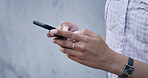 Typing, hands and woman outdoor with phone, post comment or chat update on weekend break. Happy, digital and girl on wall with mobile, internet scroll or online messaging on Sunday afternoon.
