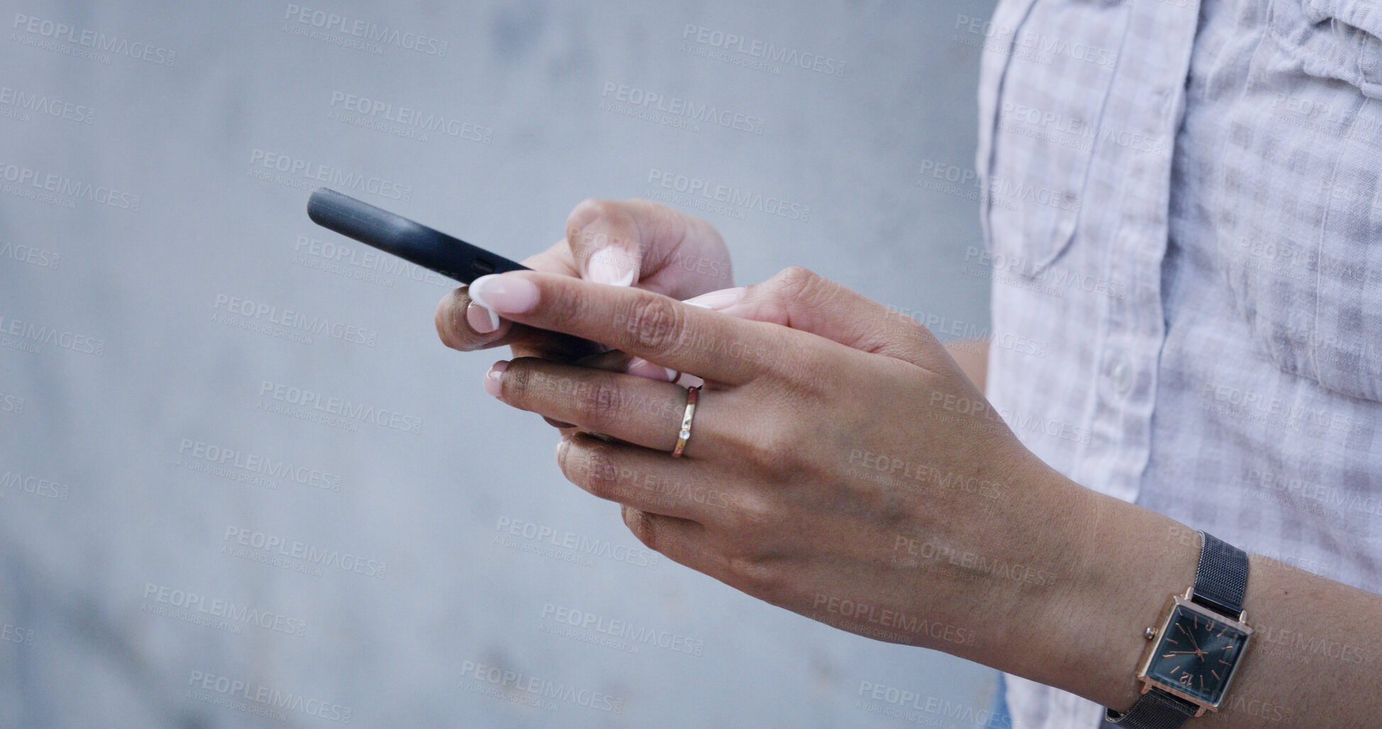 Buy stock photo Typing, hands and woman outdoor with phone, post comment and chat update on social media. Message, content browse and girl at wall with mobile, internet scroll and messaging reply on digital app.