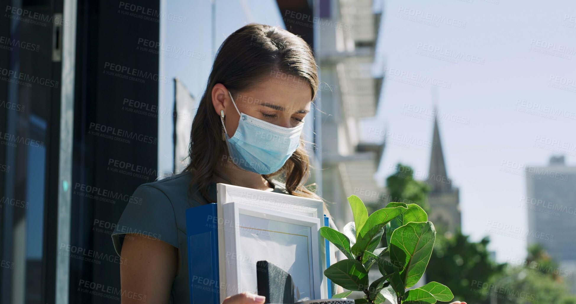 Buy stock photo Dismissal, sad and woman with box in city, contract termination or unemployment for disappointment. Layoff, personal belonging or upset person with mask outdoor, jobless and crisis for career setback