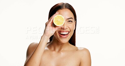 Buy stock photo Studio, portrait and woman with lemon, skincare and happiness for collagen boost or facial treatment. White background, space and person with fruit for natural cosmetics, vitamin c and dermatology