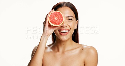 Buy stock photo Skincare, grapefruit and portrait of woman in studio with natural, health or wellness routine. Happy, vitamin c and person with citrus fruit for brightening, glow or cleanse face by white background.