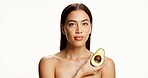 Woman, avocado and beauty in studio portrait with mockup space, skincare or benefits on white background. Person, model and organic fruit for antioxidants, oil or natural cosmetics for glow in Mexico