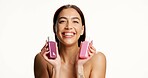 Woman, beauty and bottle for skincare in studio with smile, mockup space and portrait on background. Gen z girl, cosmetics and happy with product placement, dermatology and container in Colombia