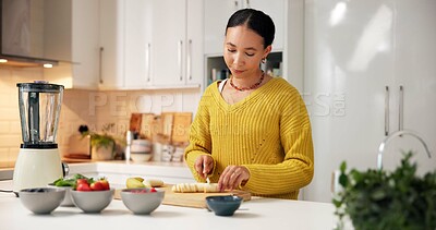 Buy stock photo Woman, nutrition or banana with fruit in kitchen for organic meal prep, smoothie or blender in home. Female person, nutritionist and cutting natural food for healthy recipe, diet or wellness in house