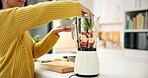 Smoothie, fruit and woman with blender in home for healthy drink, diet and detox in kitchen. Hands, protein shake and person with ingredients, vegetables and food for nutrition, wellness and vitamins