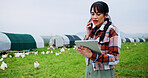 Chicken, phone call and tablet with woman on farm for planning, strategy or sustainability. App, conversation and research with farmer person outdoor on grass field for management of livestock