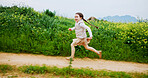 Energy, excited and running with girl outdoor in countryside for child development or growth. Adventure, path and space with happy kid in green nature for activity, journey or wilderness experience