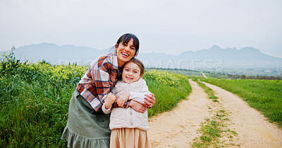 Buy stock photo Portrait, countryside and mother hug child for bonding, love and connection for weekend vacation. Farm holiday, space and happy woman with support for girl, laugh and outdoor embrace for relationship