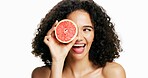 Happy woman, grapefruit and beauty with skincare in studio for vitamin C on a white background. Female person, model or smile with natural organic fruit, health or wellness for diet or antioxidant