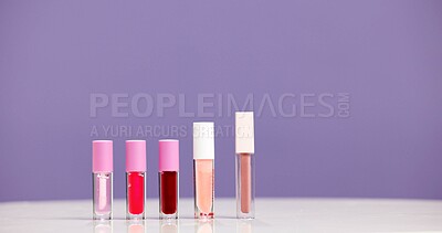 Buy stock photo Bottle, lipstick and marketing for skincare in studio with mockup, space or promotion on purple background. Beauty, product and advertising for cosmetic care, aesthetic selection and presentation