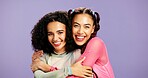 Hug, skincare and portrait of friends in studio for support, beauty and aesthetic glow. Bonding, gen z connection and cosmetology with women on purple background for self care, shine and glow