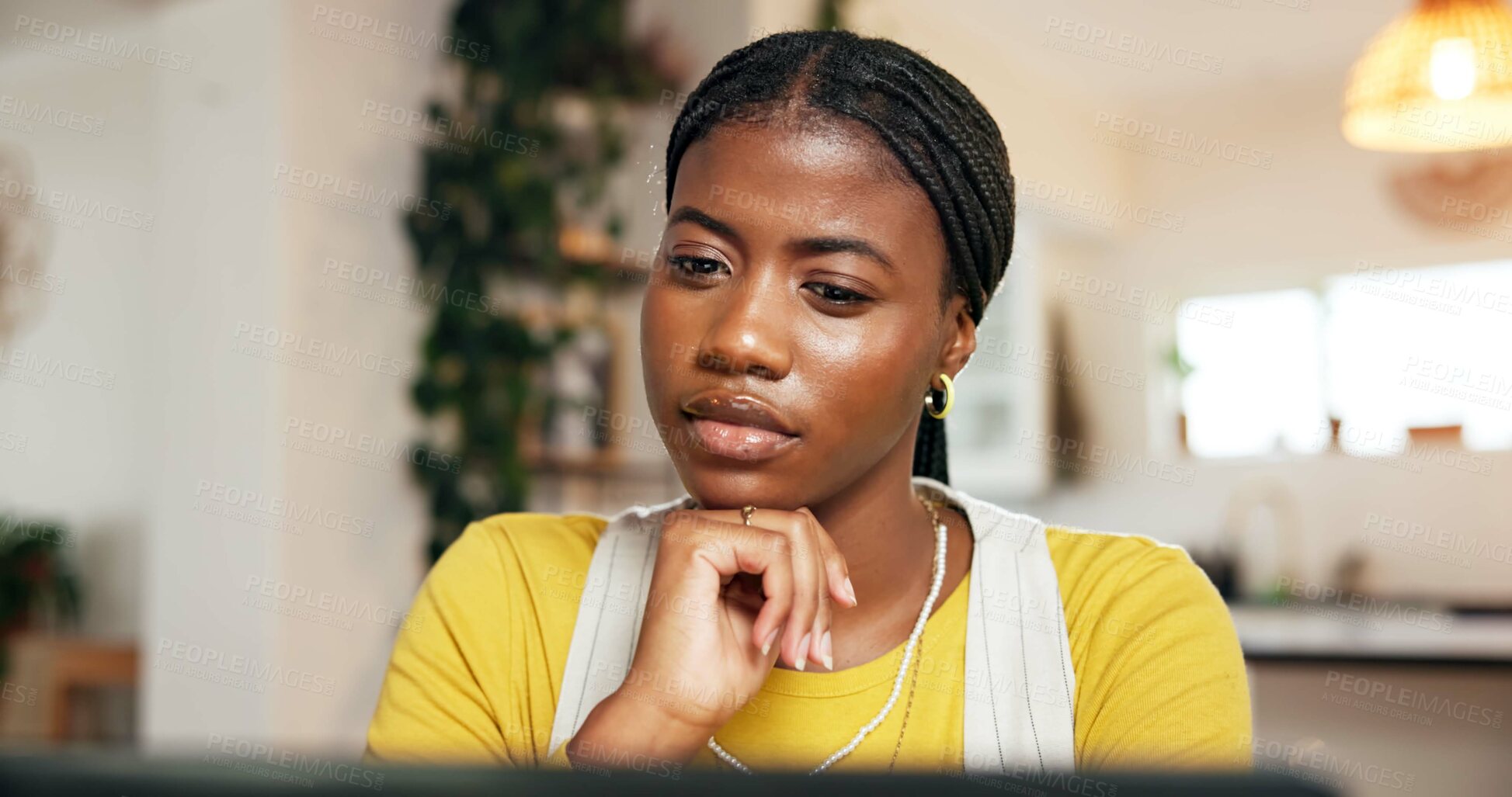Buy stock photo Laptop, reading and remote work with black woman at desk in home for startup planning or research. Computer, small business and thinking with African freelancer in apartment for report or review