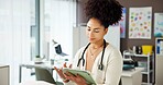 Woman, pediatrician and scroll on tablet at clinic, report or child wellness expert at office. Person, doctor and tech with checklist for telehealth, application or smile for notification at hospital