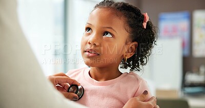 Buy stock photo Medical, pediatrician and stethoscope with girl child in hospital for consulting or trust. Checkup, heartbeat or healthcare with doctor and kid patient in clinic for advice, healing or wellness