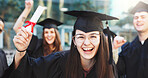 Graduation, success and portrait of woman in college for achievement, scholarship and degree diploma. University certificate, academy pride and scroll with students on campus for award ceremony