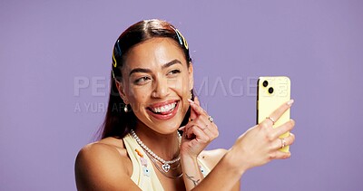 Buy stock photo Beauty, finger heart and selfie with influencer woman in studio for product review on social media. App, smile and tongue out playful content creator isolated on purple background for post or update