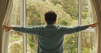 Buy stock photo Curtain, window and back of man in hotel room for morning routine, accommodation getaway and relax. Wake up, hospitality and view with person in house rental for comfortable, trip and sunrise