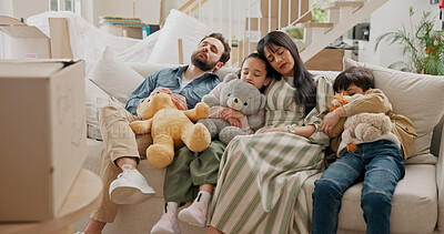 Buy stock photo Parents, children and sleeping on sofa in new home, moving or toys with boxes, care and tired in lounge. People, family and kids with rest, exhausted and property with real estate investment in house