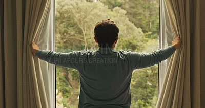 Buy stock photo Wake up, window and back of man in hotel room for morning routine, accommodation getaway and relax. Curtain, hospitality and view with person in house rental for comfortable, trip and sunrise