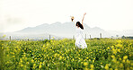 Dancing, woman and freedom in field, fun and adventure in nature, traveler and fresh air on holiday. Outdoor, space and person on summer vacation, excited and break in countryside or celebration
