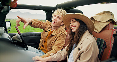 Buy stock photo Travel, happy couple and pointing in car for road trip, holiday adventure and sightseeing together. Love, people and weekend getaway in vehicle for countryside tourism, vacation journey and exploring