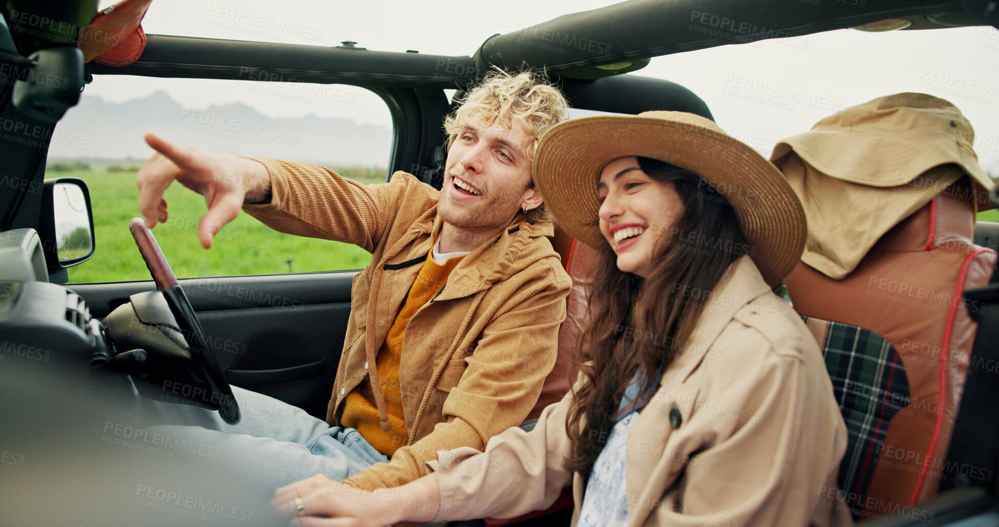 Buy stock photo Travel, happy couple and pointing in car for road trip, holiday adventure and sightseeing together. Love, people and weekend getaway in vehicle for countryside tourism, vacation journey and exploring