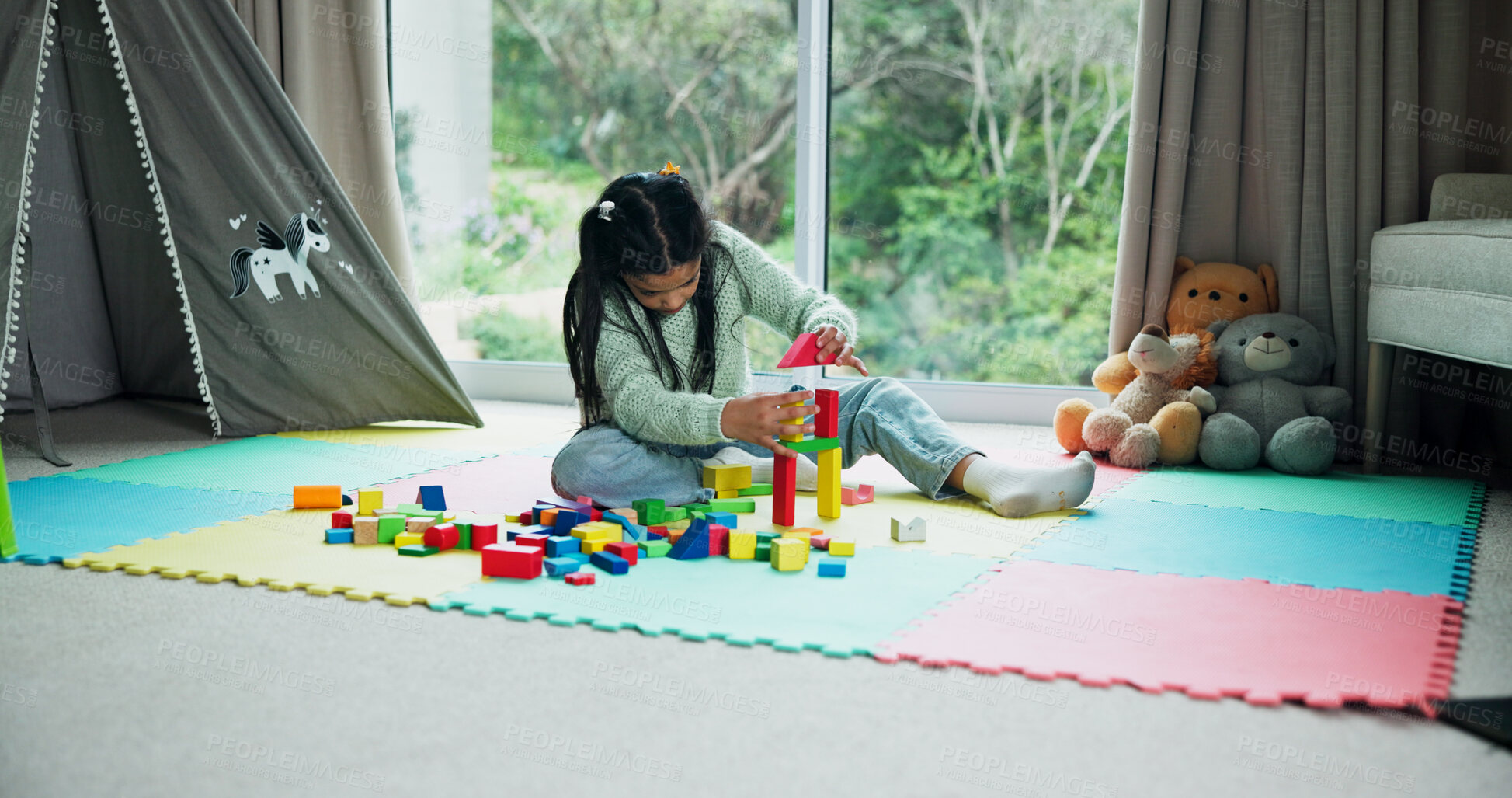 Buy stock photo Building blocks, relax and game with kid in home for learning, creative puzzle and growth. Child development, problem solving and wooden toys with girl in playroom of house for solution and shapes