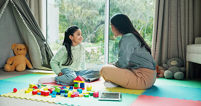 Buy stock photo Mother, girl and learning with blocks in home, happy or bonding with talk on floor for development. People, mom and child with smile for discussion, teaching or support for education at family house